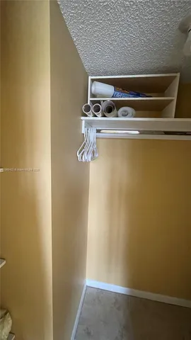 a bathroom with a sink toilet a mirror and shower