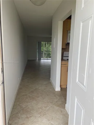 a kitchen with a stove a sink and a microwave