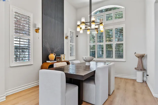 a dining room with furniture and window