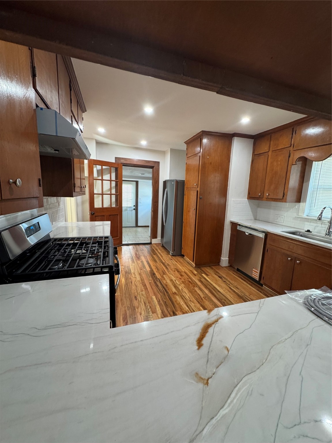 2713 Cochran Street Houston, TX 77009 - Photo 13 of 28 a bedroom with a large bed and a sink