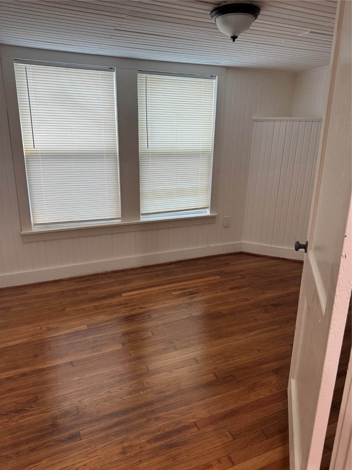 2713 Cochran Street Houston, TX 77009 - Photo 25 of 28 a view of an empty room with wooden floor and a window