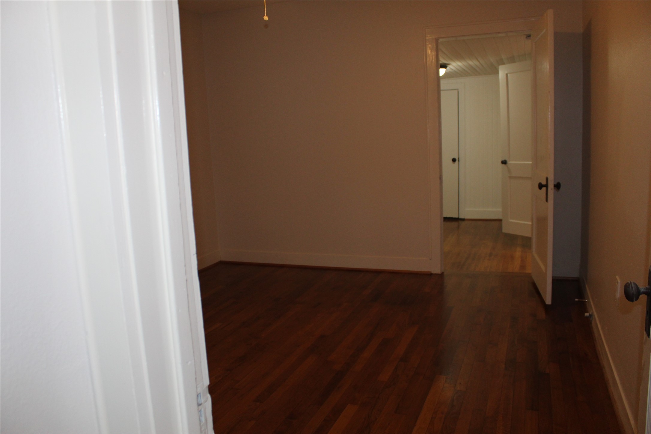 2713 Cochran Street Houston, TX 77009 - Photo 10 of 28 a view of a hallway with wooden floor