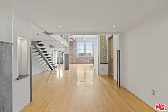 a view of entryway with wooden floor