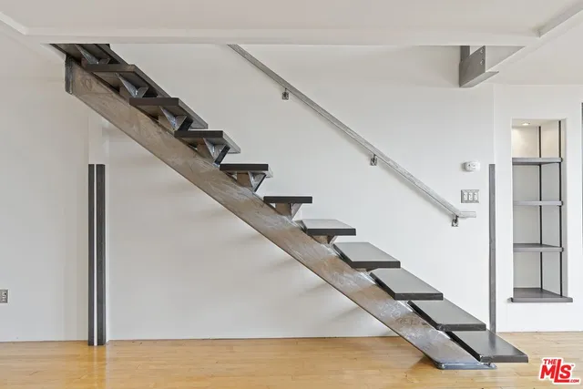 a view of a hallway with a chandelier