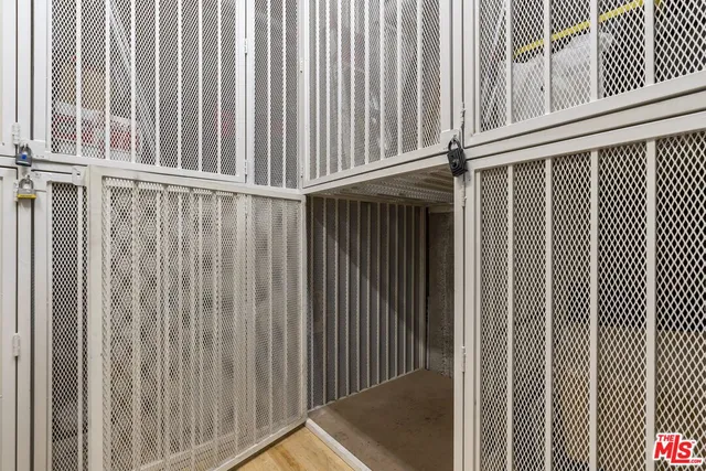 a view of a building with a yard and plants