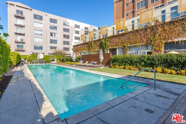 a view of a chair and table in backyard