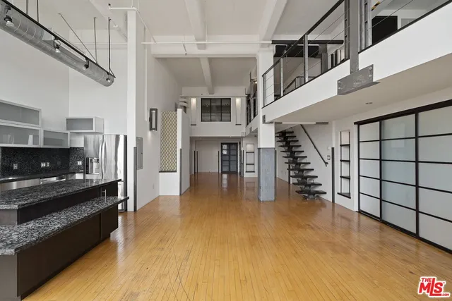 a view of living room with furniture and flat screen tv