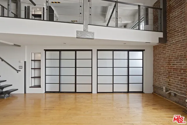 a view of a ceiling fan and window