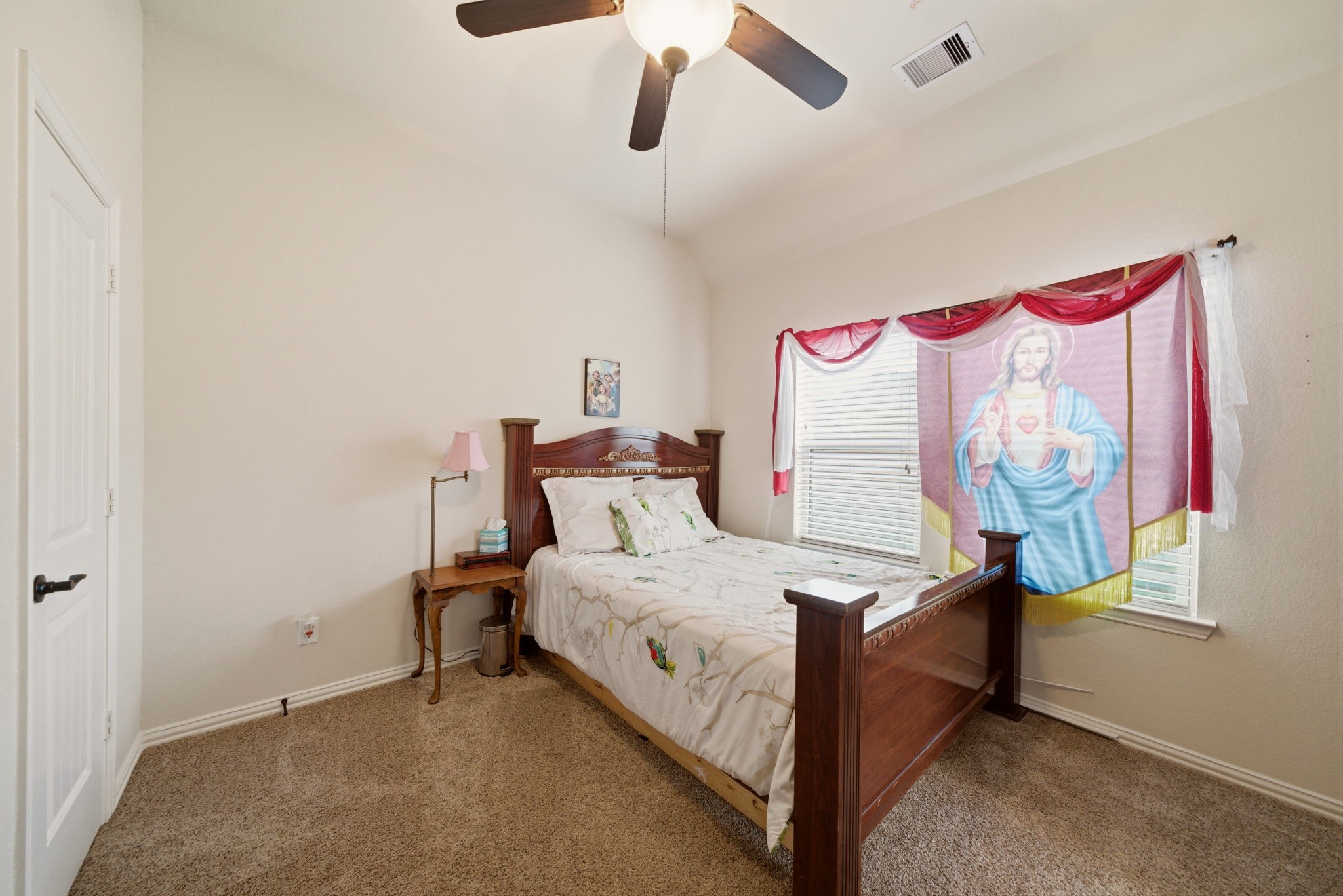 21807 Lozar Drive Spring, TX 77379 - Photo 11 of 20 a bedroom with a bed and a window