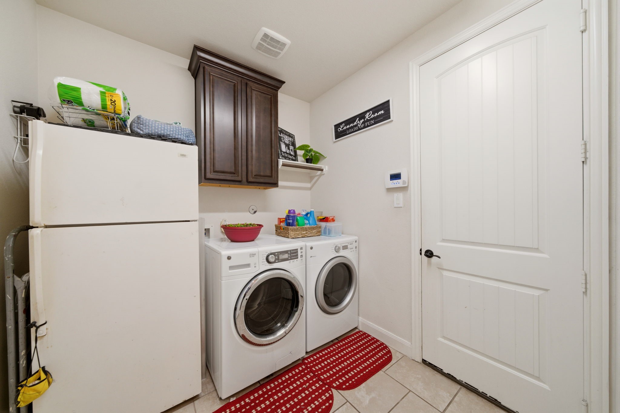 21807 Lozar Drive Spring, TX 77379 - Photo 13 of 20 a utility room with dryer and washer