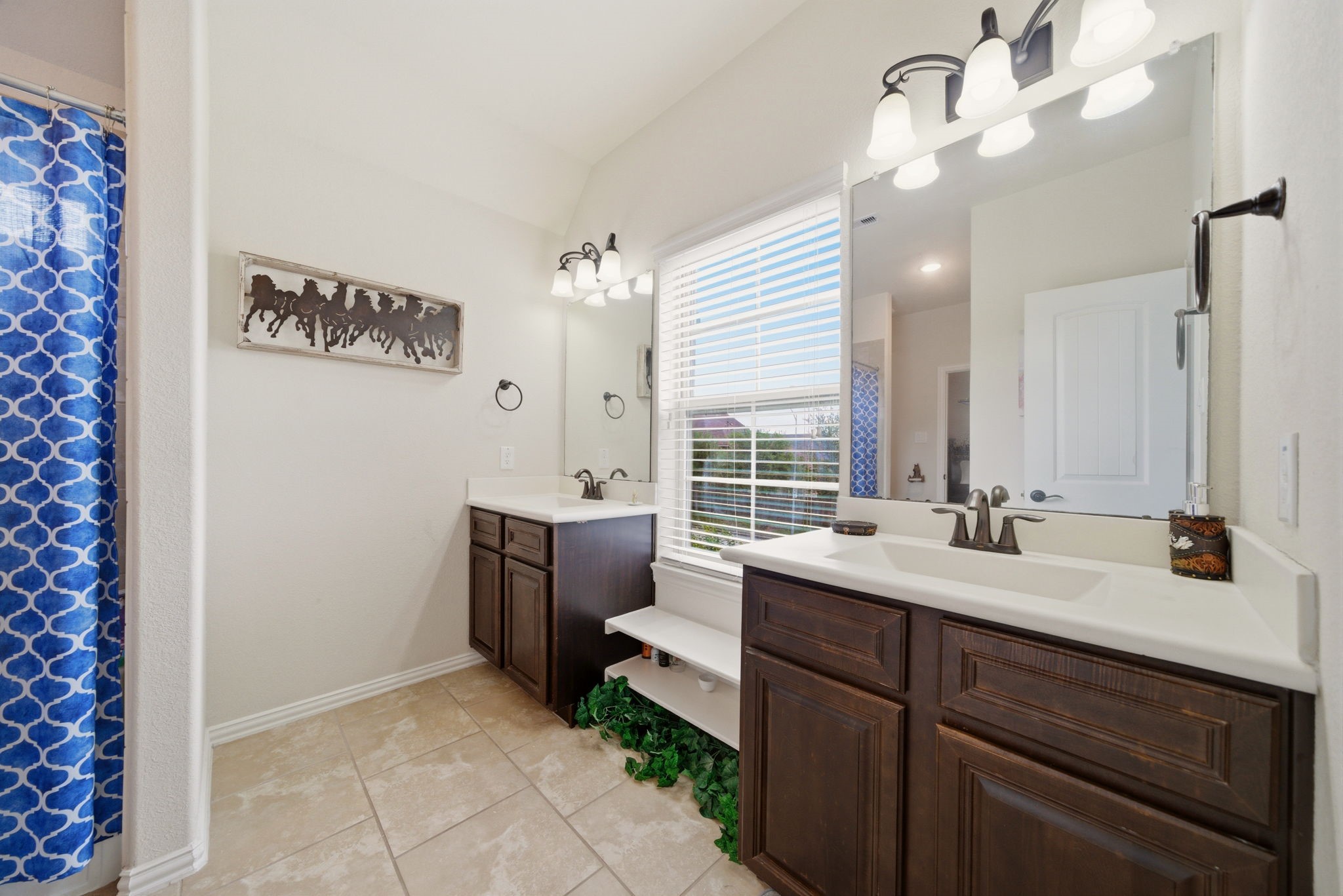 21807 Lozar Drive Spring, TX 77379 - Photo 16 of 20 a bathroom with a sink and a mirror