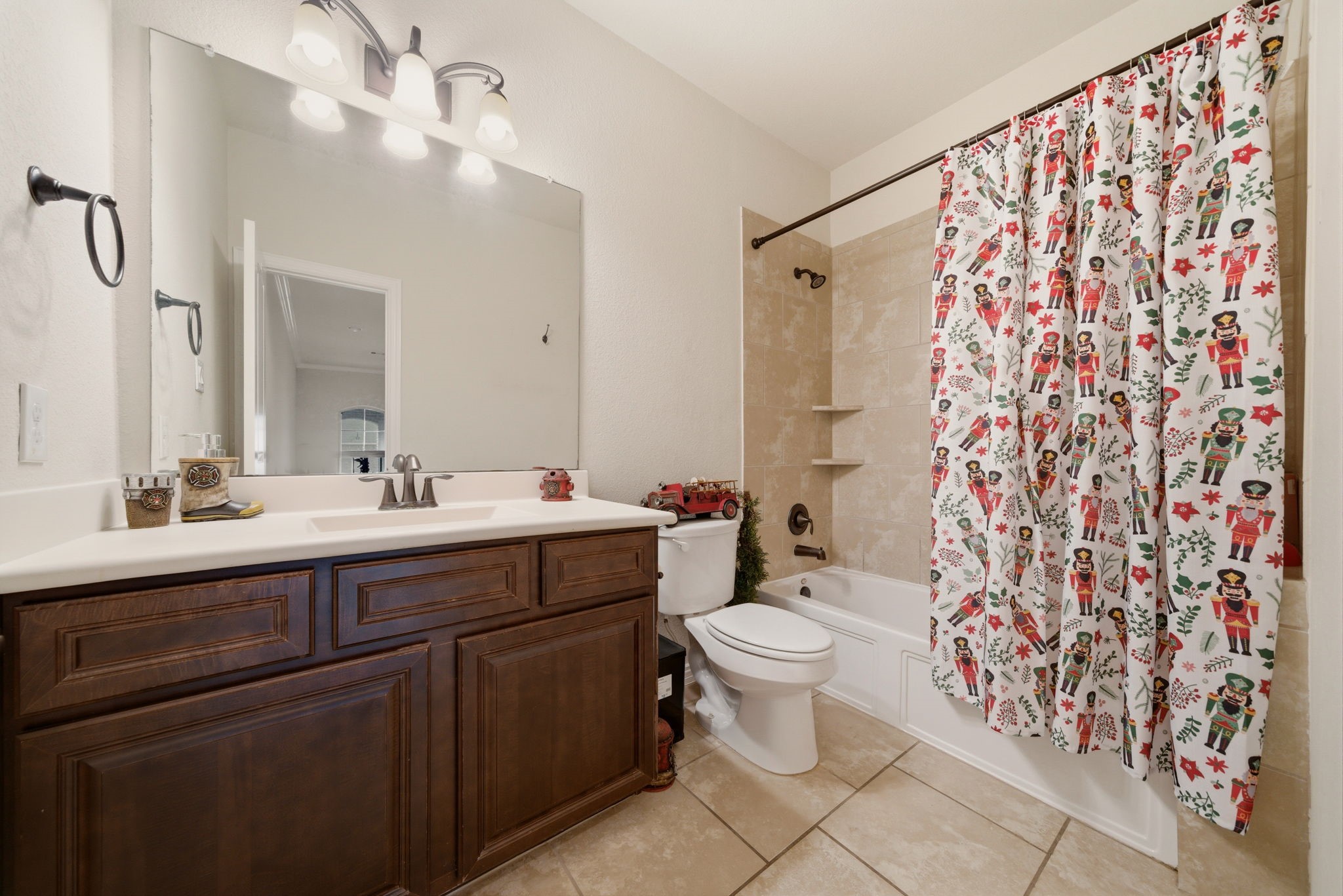 21807 Lozar Drive Spring, TX 77379 - Photo 17 of 20 a bathroom with a sink toilet and shower