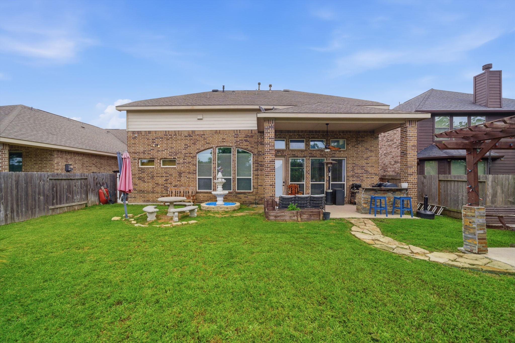 21807 Lozar Drive Spring, TX 77379 - Photo 18 of 20 a view of a house with a yard porch and sitting area