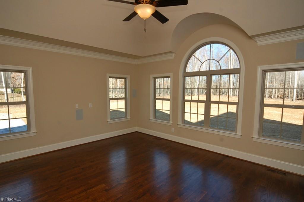 7502 Hearthridge Court Oak Ridge, NC 27310 - Photo 14 of 30 Spacious den/family room is wired for surround sound.