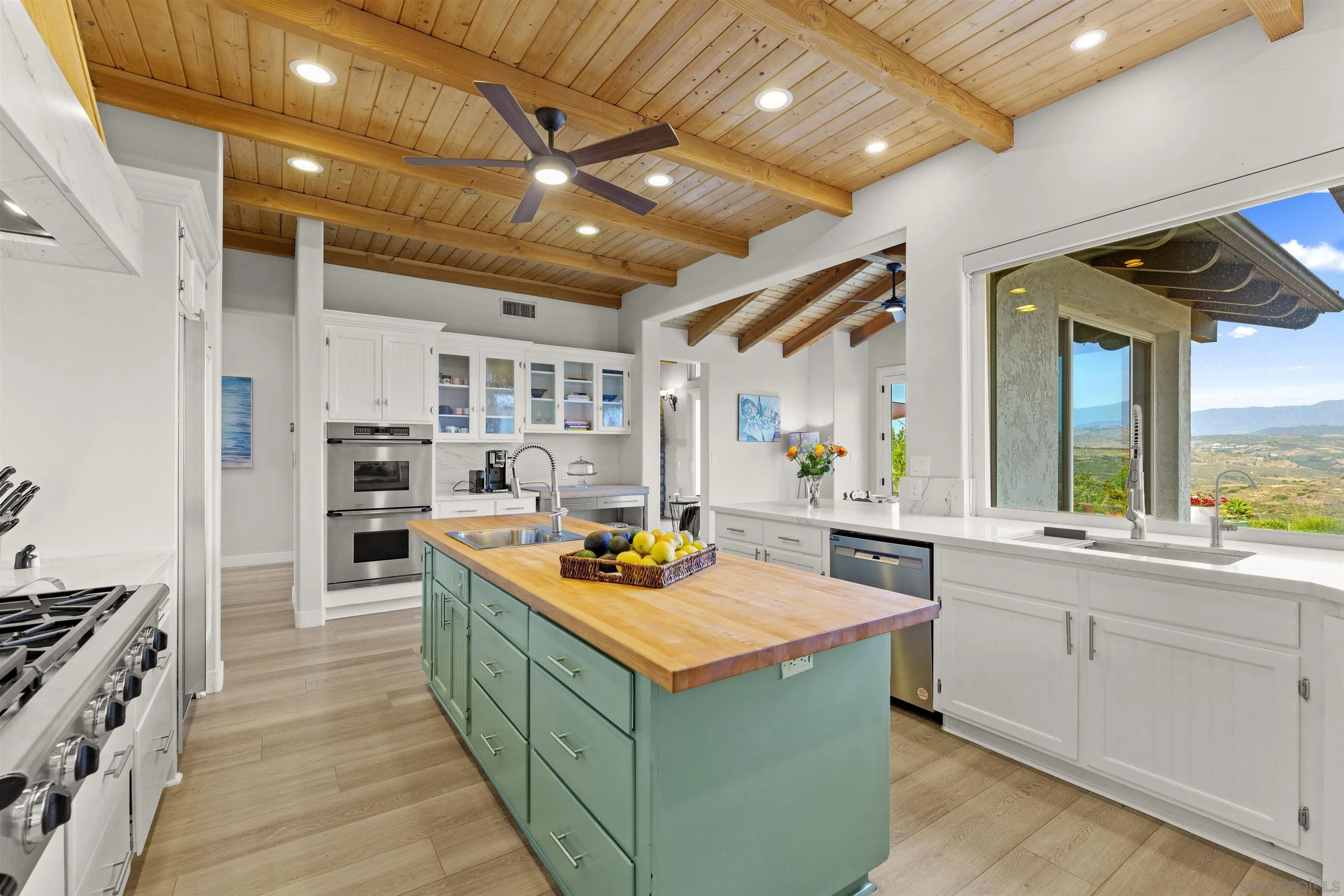 30659 Diaz Road Valley Center, CA 92082 - Photo 9 of 44 a kitchen with stainless steel appliances granite countertop lots of counter top space
