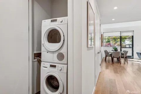 a view of a hallway with washer and dryer