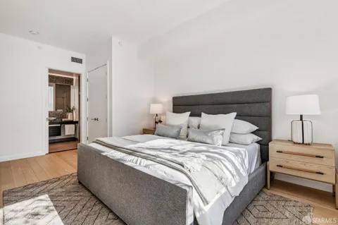 a bedroom with double bed and a night stand