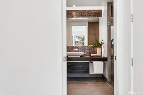 a bathroom with a sink and a mirror