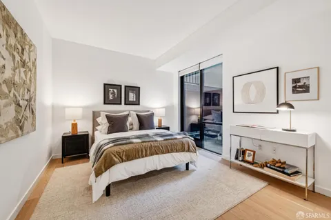 a bedroom with bed and a window