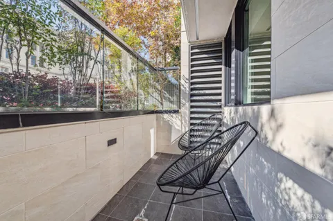 a view of a porch with furniture and a window