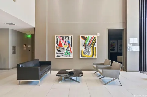 a view of a lobby with furniture and windows