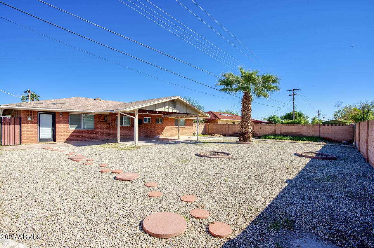 1881 East Concorda Drive Tempe, AZ 85282 - Photo 15 of 15 a view of a house with a yard