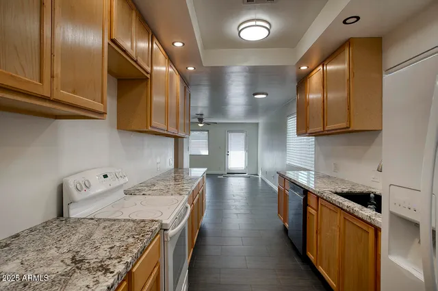 a kitchen with a stove and a sink