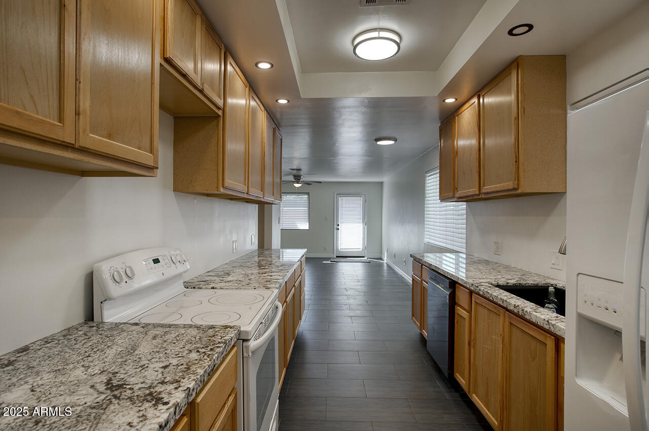 1881 East Concorda Drive Tempe, AZ 85282 - Photo 5 of 15 a kitchen with a stove and a sink