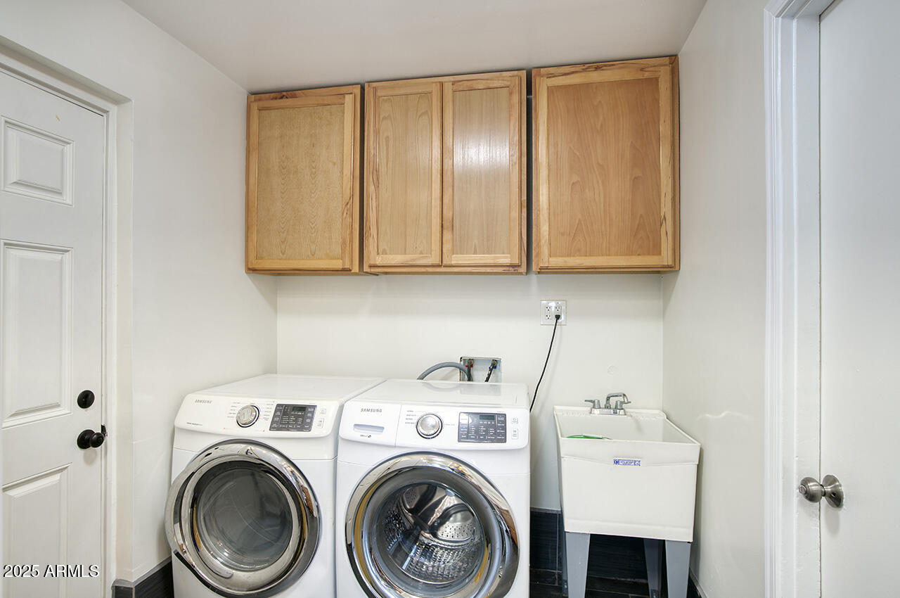 1881 East Concorda Drive Tempe, AZ 85282 - Photo 6 of 15 a view of storage and utility room with washer and dryer