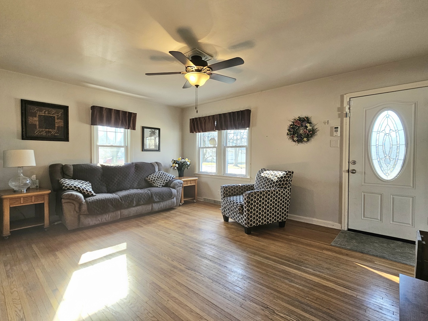 122 South Park Road Joliet, IL 60433 - Photo 2 of 19 a living room with furniture a bed and a window