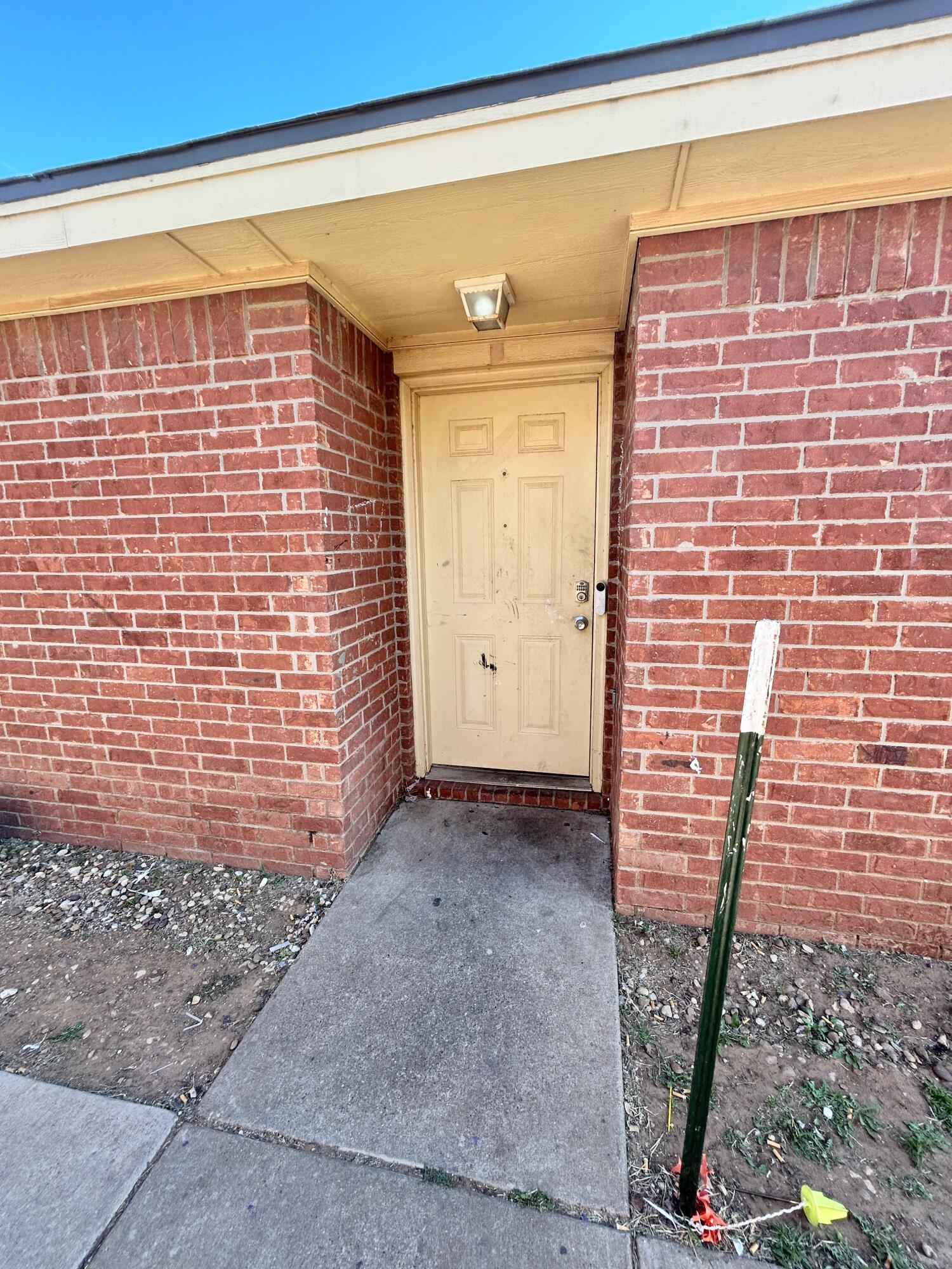 1112 82nd Street, Unit B Lubbock, TX 79423 - Photo 1 of 1 a view of front door of house