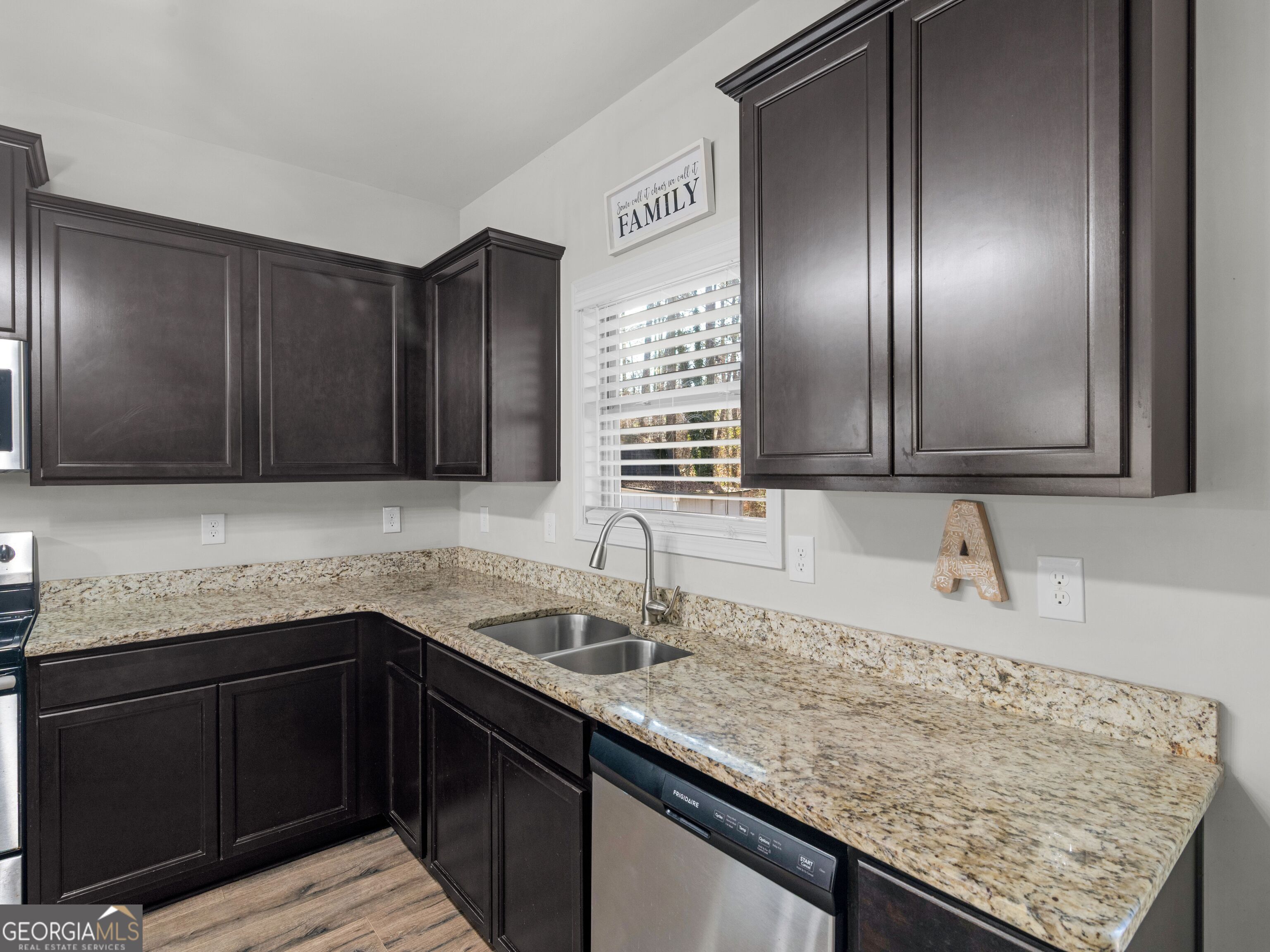 57 Partridge Court Monticello, GA 31064 - Photo 14 of 47 a kitchen with granite countertop stainless steel appliances a sink stove and cabinets