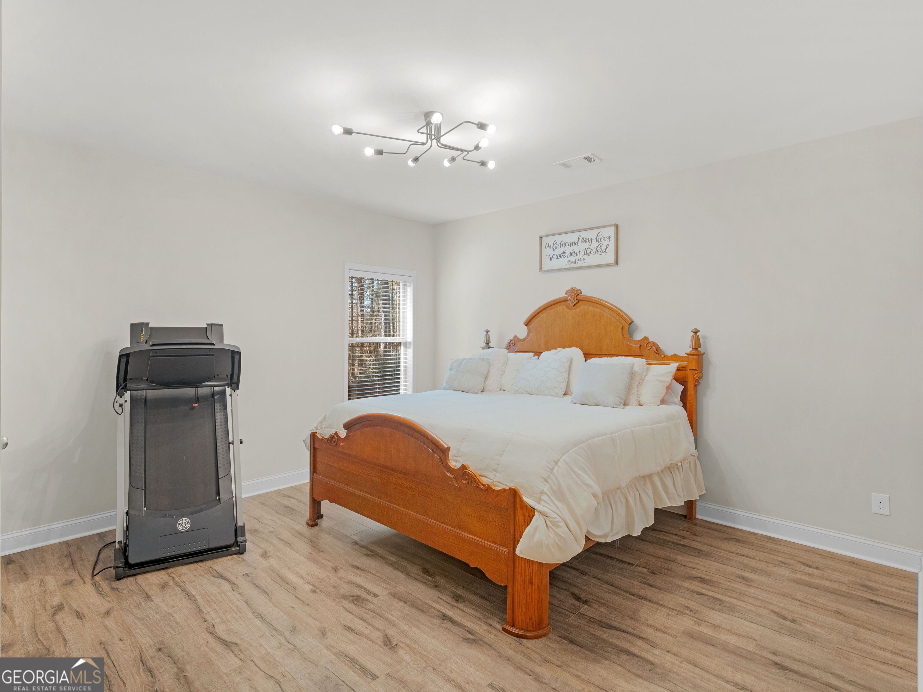 57 Partridge Court Monticello, GA 31064 - Photo 20 of 47 a bedroom with a bed and wooden floor