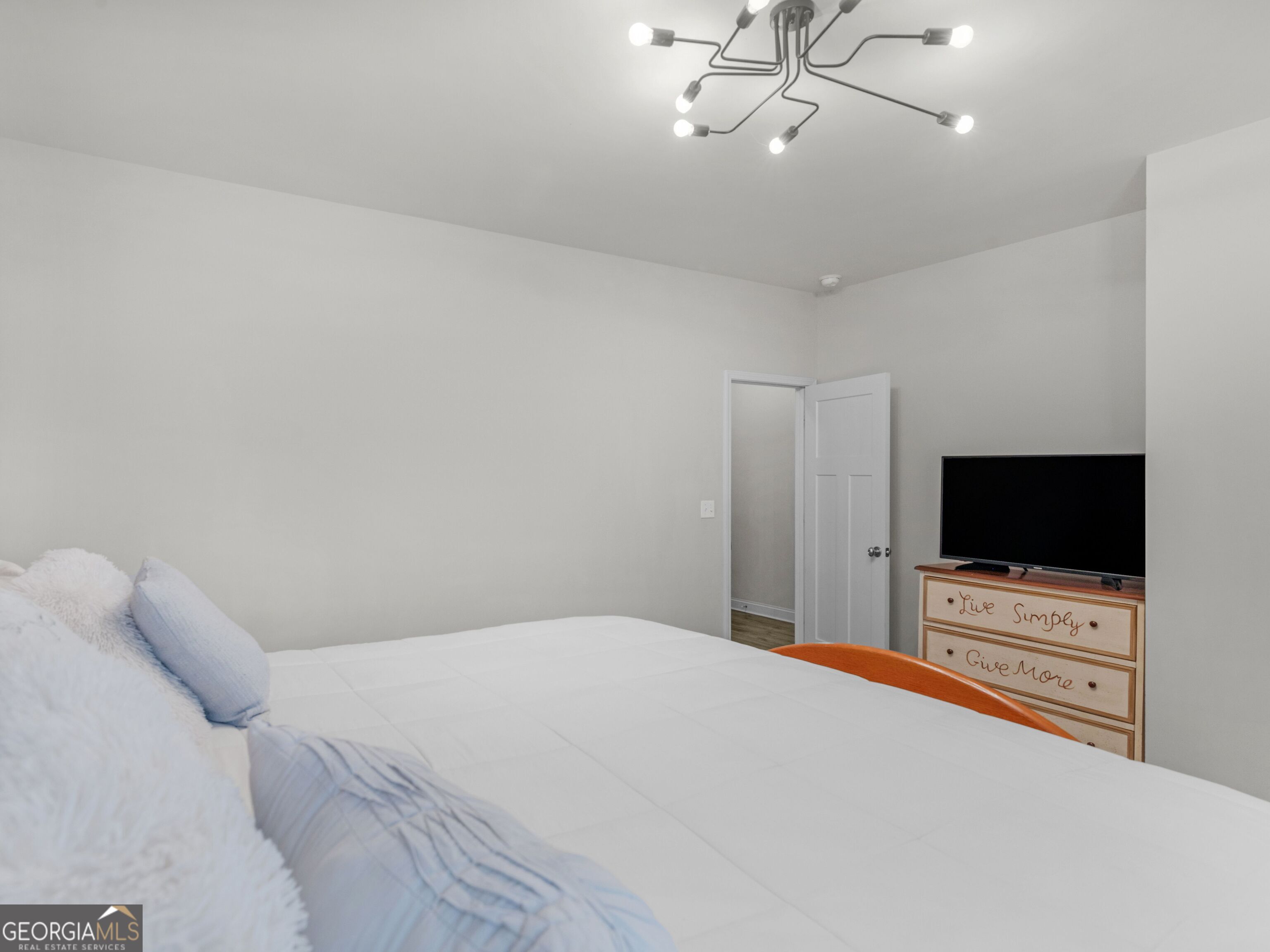 57 Partridge Court Monticello, GA 31064 - Photo 23 of 47 a bedroom with a bed and a flat screen tv