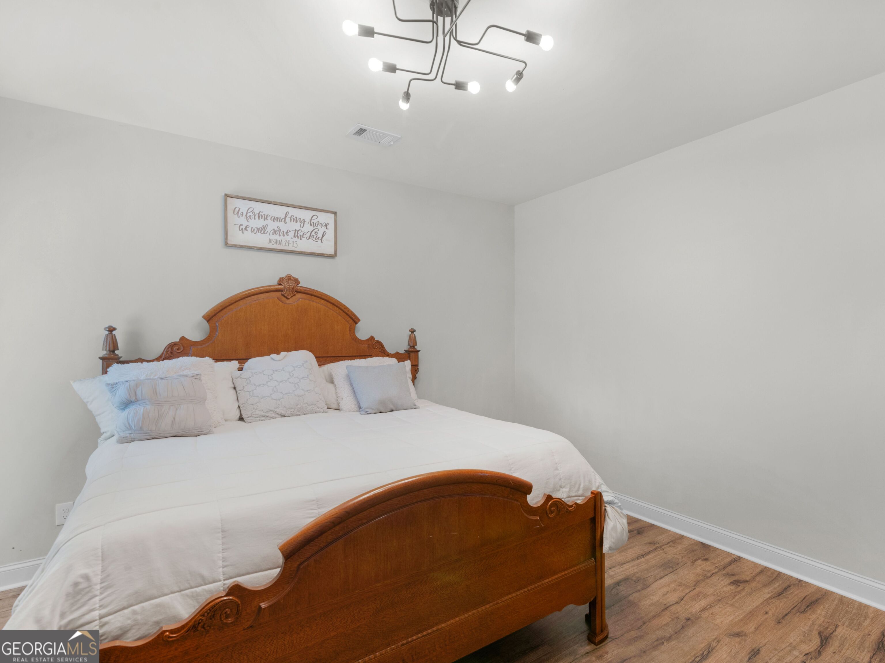 57 Partridge Court Monticello, GA 31064 - Photo 24 of 47 a bedroom with a bed and wooden floor