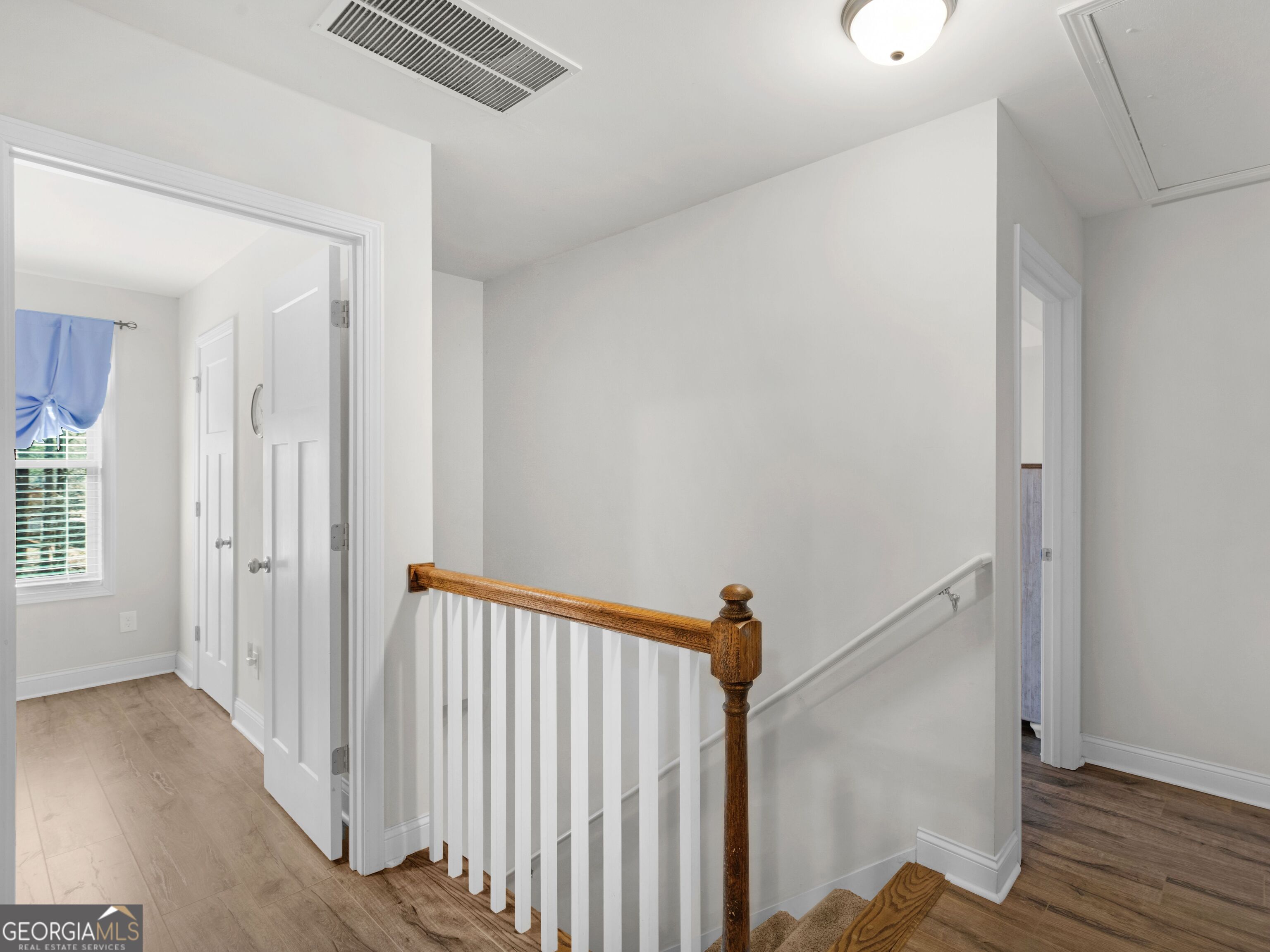 57 Partridge Court Monticello, GA 31064 - Photo 27 of 47 a view of a room with wooden floor staircase and windows