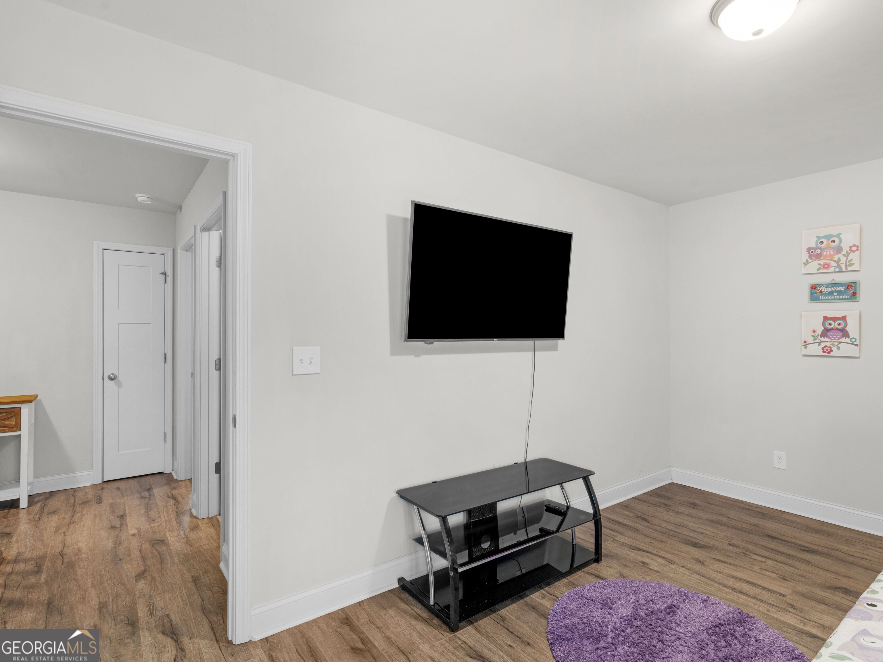 57 Partridge Court Monticello, GA 31064 - Photo 30 of 47 a living room with furniture and a flat screen tv