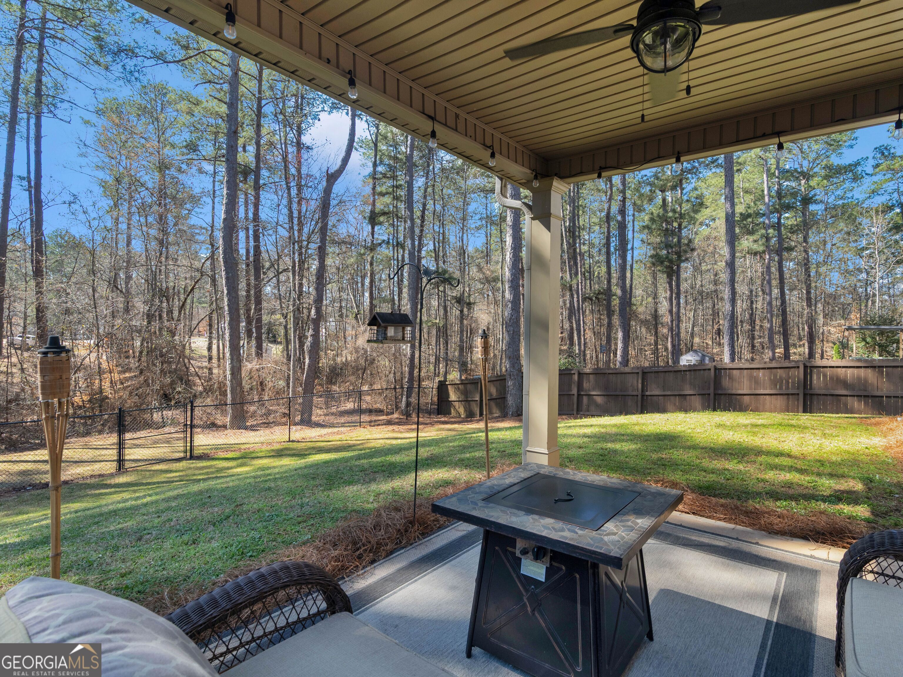57 Partridge Court Monticello, GA 31064 - Photo 4 of 47 a backyard of a house with barbeque oven table and chairs