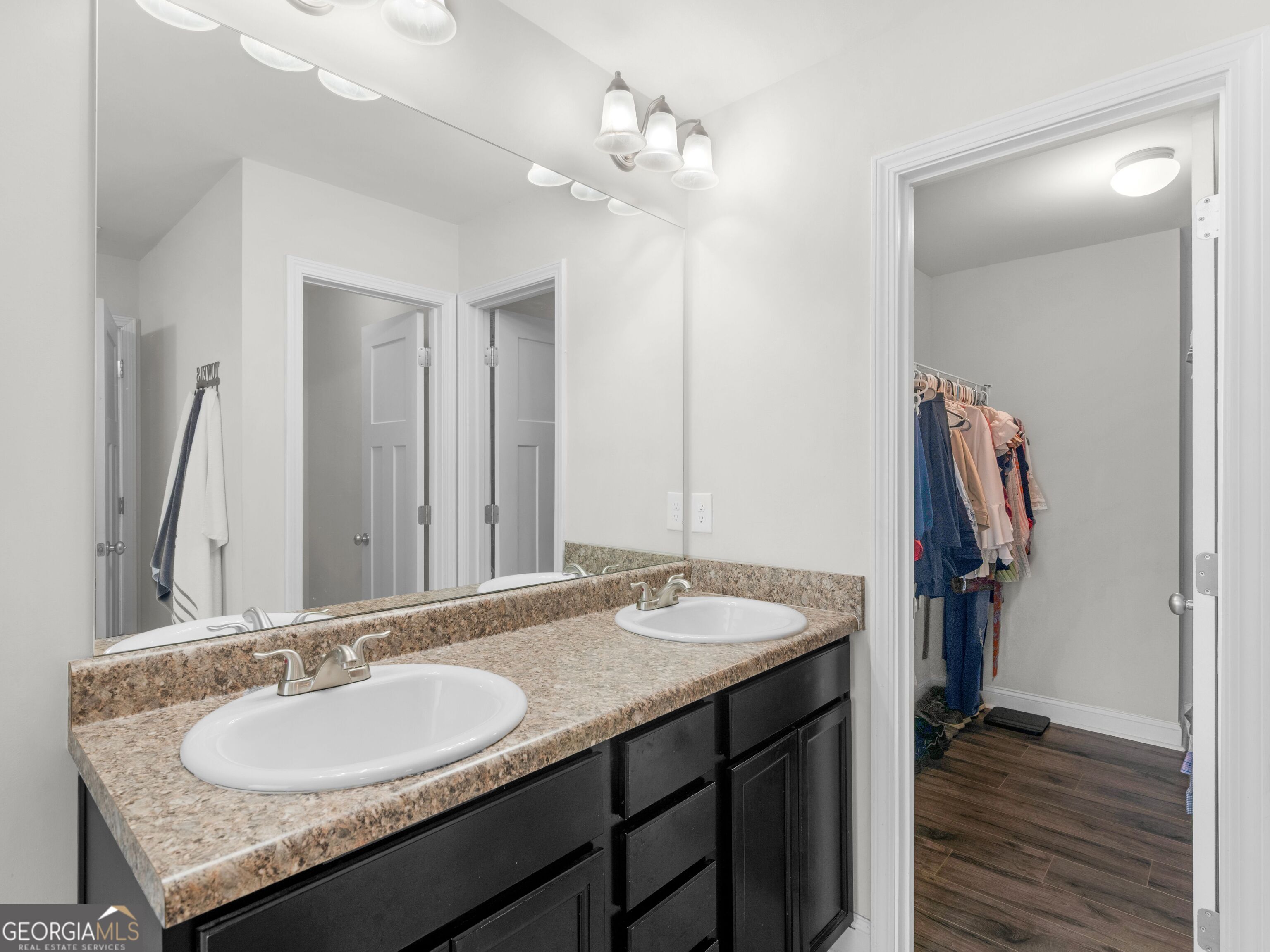 57 Partridge Court Monticello, GA 31064 - Photo 42 of 47 a bathroom with a granite countertop sink and a mirror