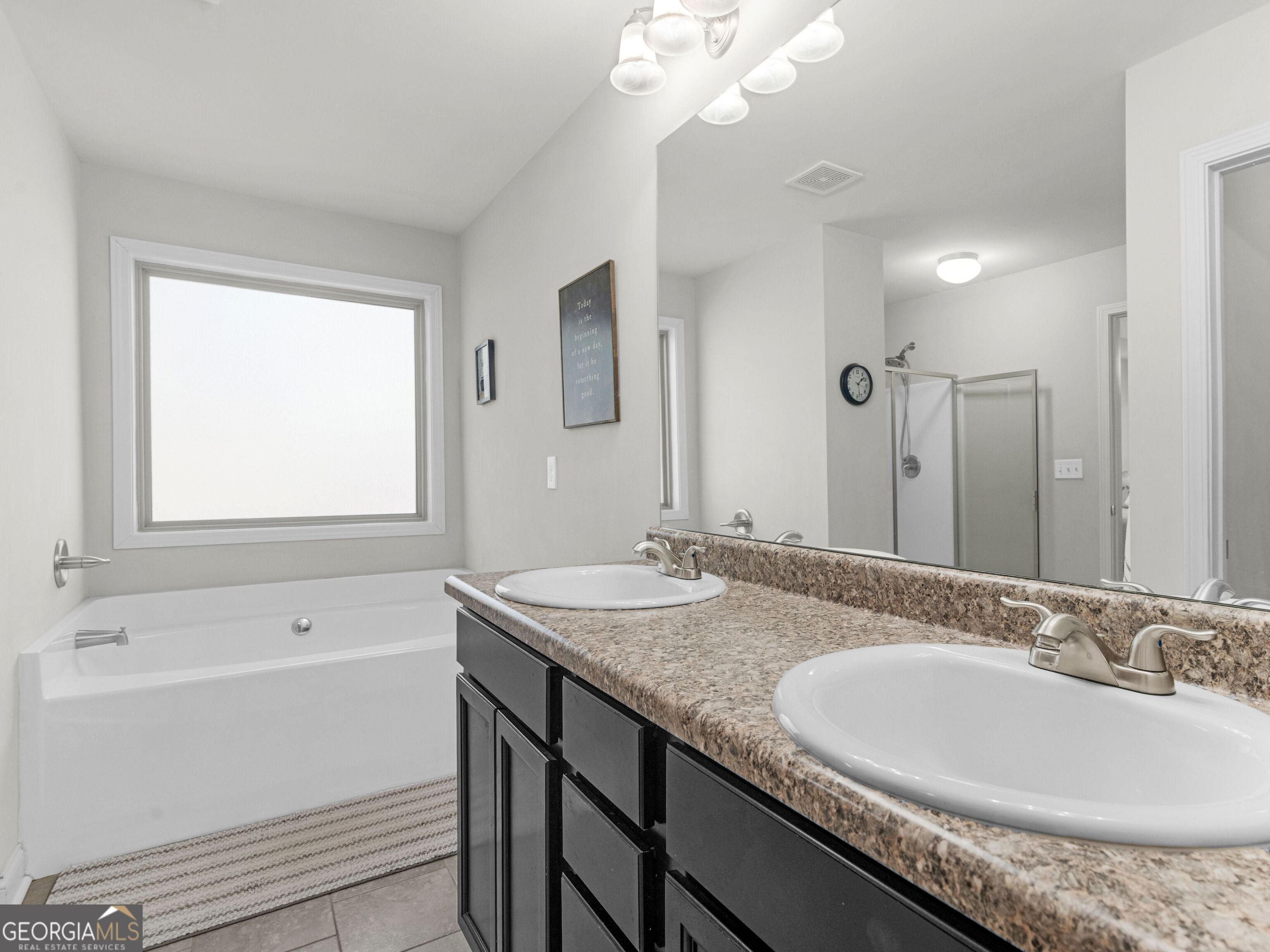 57 Partridge Court Monticello, GA 31064 - Photo 44 of 47 a bathroom with a granite countertop sink a large mirror and a bathtub