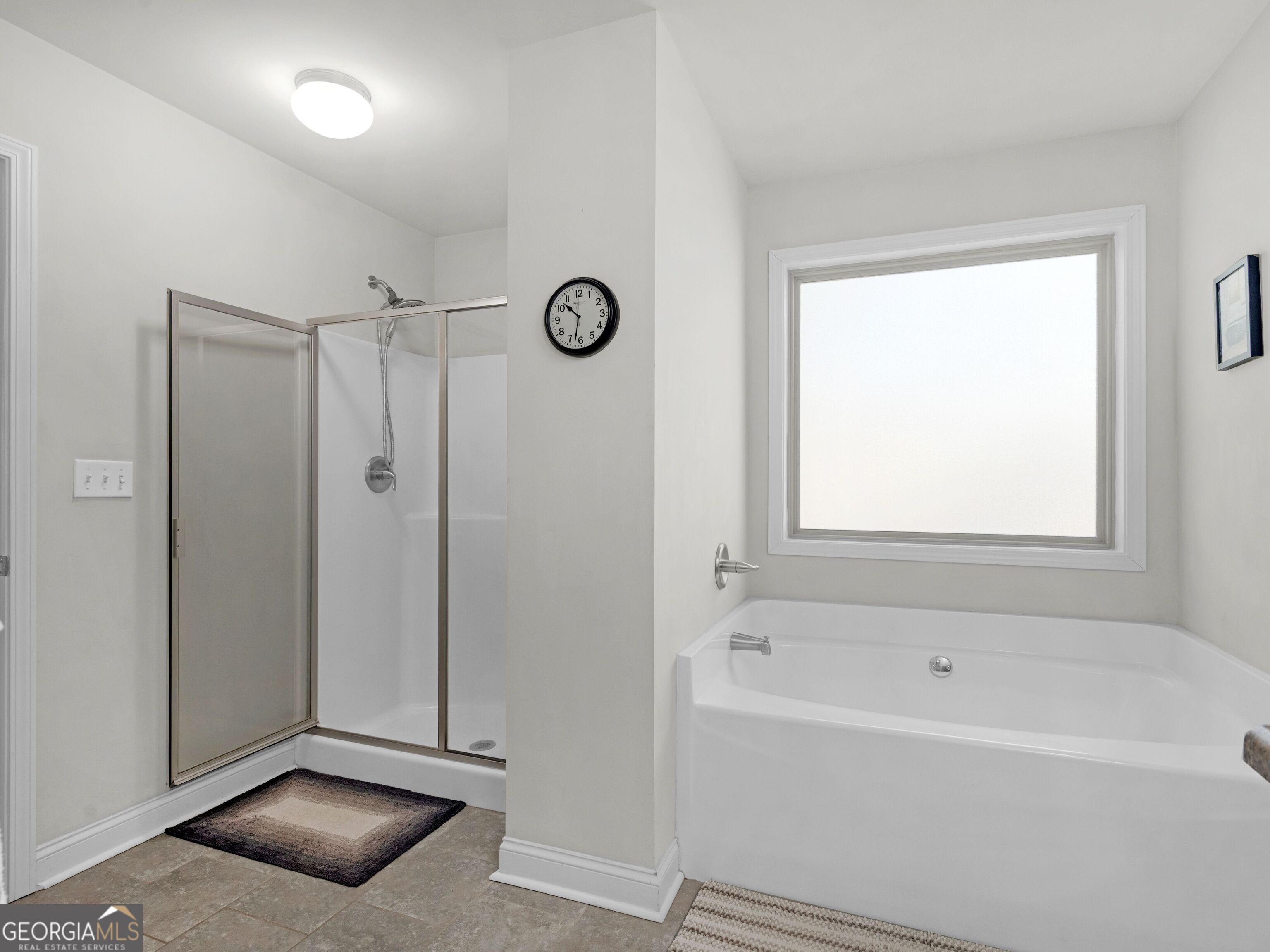 57 Partridge Court Monticello, GA 31064 - Photo 45 of 47 a bathroom with a tub shower and a window