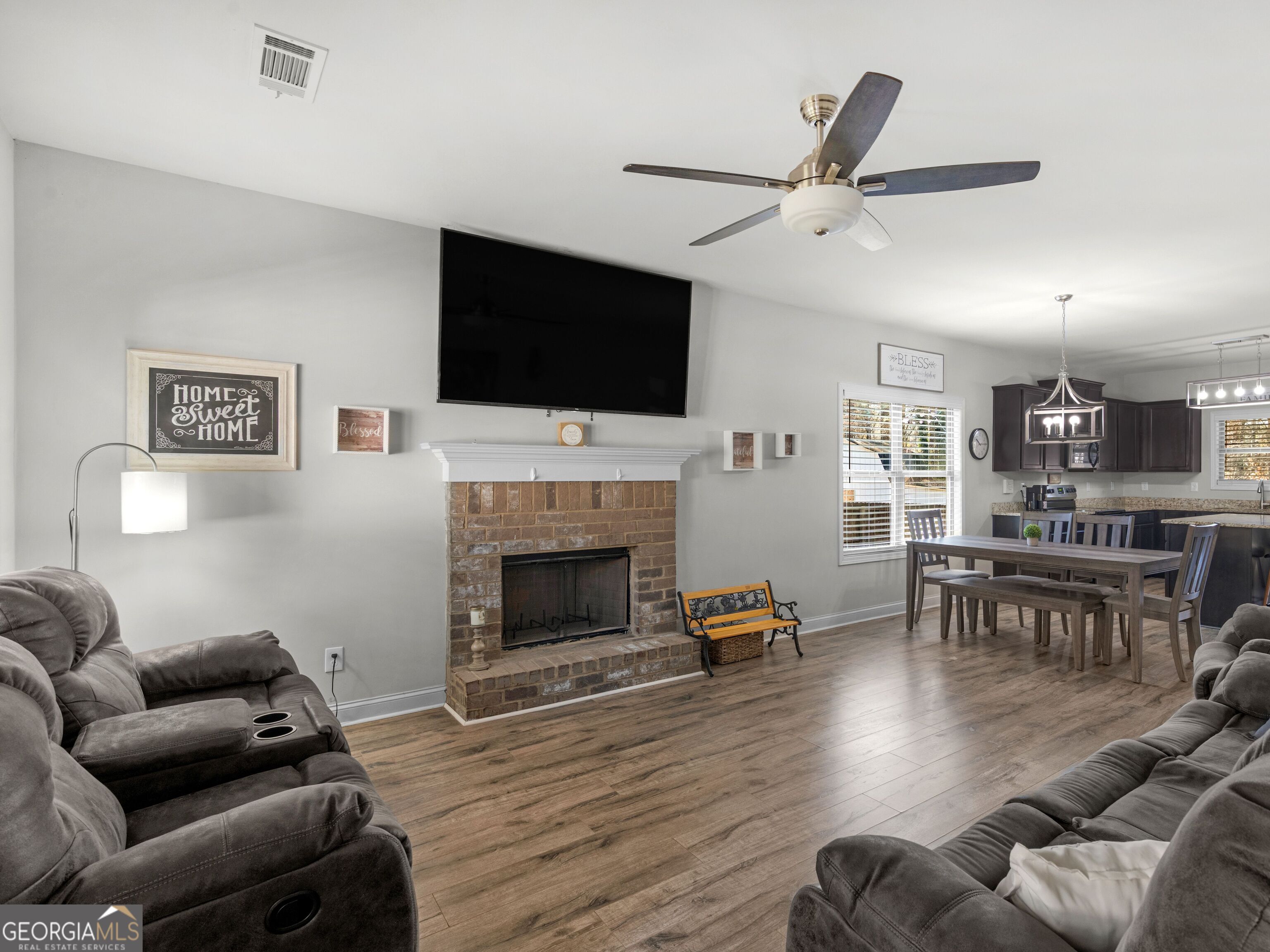 57 Partridge Court Monticello, GA 31064 - Photo 6 of 47 a living room with furniture fireplace and a flat screen tv