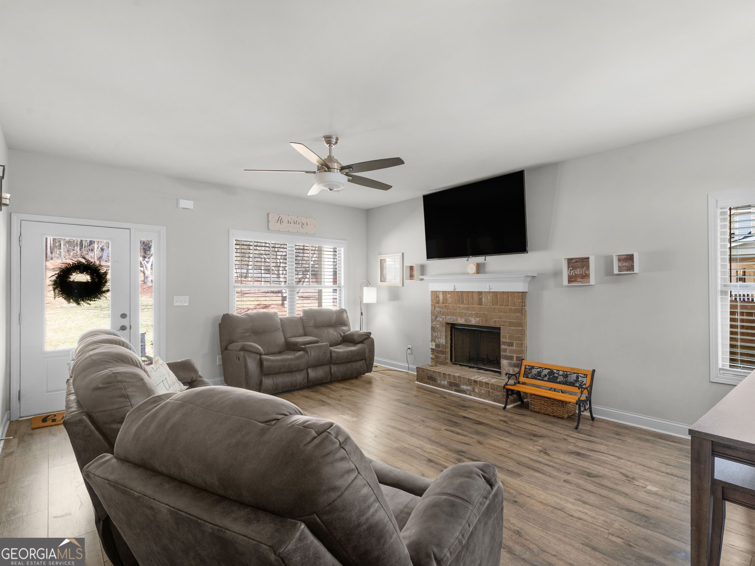 57 Partridge Court Monticello, GA 31064 - Photo 7 of 47 a living room with furniture a fireplace and a flat screen tv