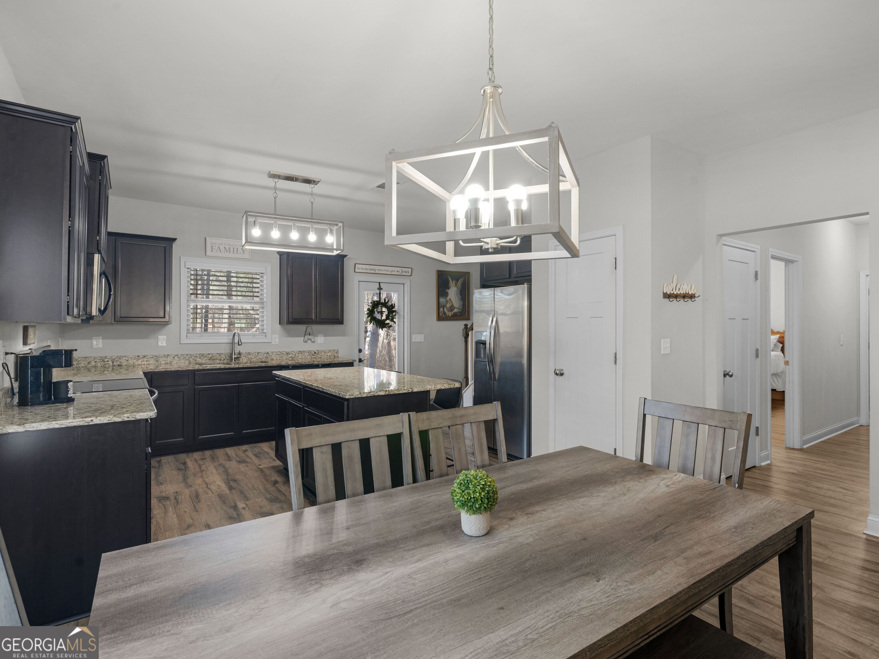 57 Partridge Court Monticello, GA 31064 - Photo 10 of 47 a view of kitchen with sink refrigerator dining table and chairs