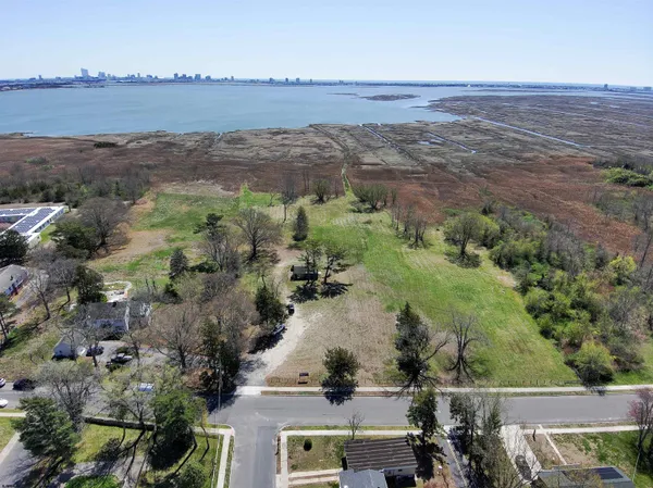 an aerial view of a house with a lake view