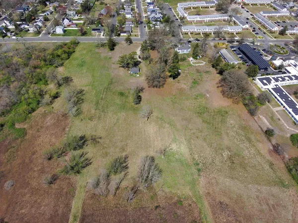 a view of a field with an trees