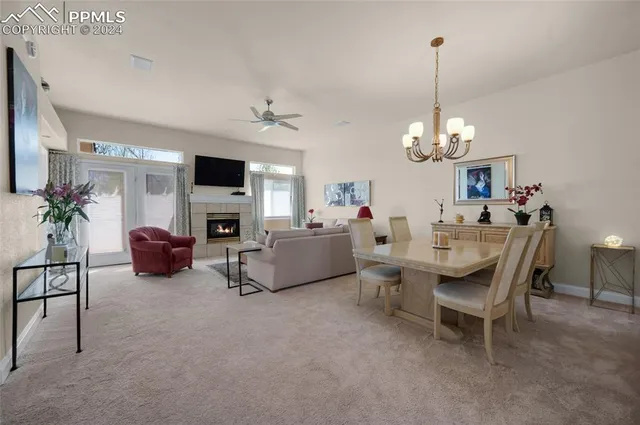 a view of a livingroom with furniture and a chandelier