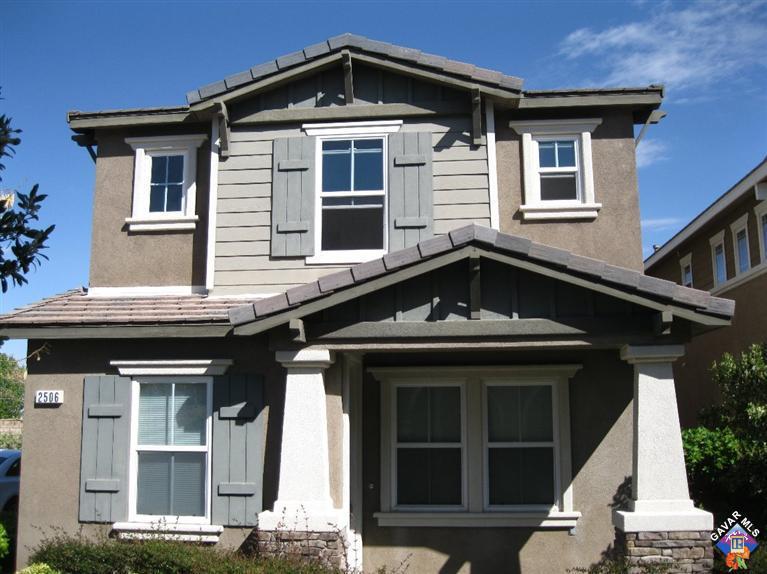 2506 Rabbit Ridge Court Palmdale, CA 93550 - Photo 1 of 15 a front view of a house with a yard