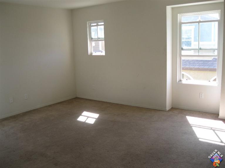 2506 Rabbit Ridge Court Palmdale, CA 93550 - Photo 13 of 15 an empty room with windows