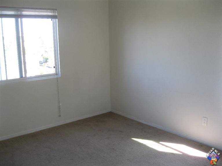 2506 Rabbit Ridge Court Palmdale, CA 93550 - Photo 15 of 15 an empty room with a window